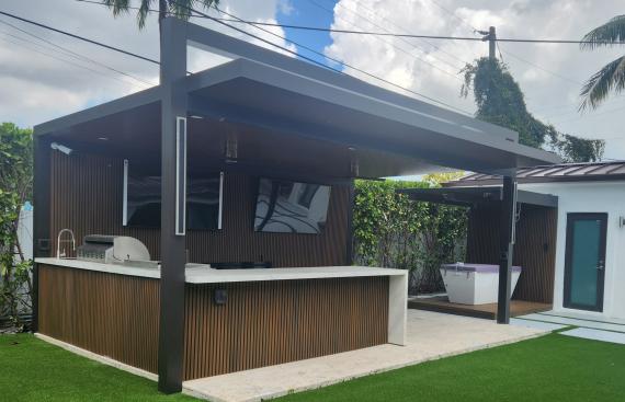 Outdoor kitchen and pergola with imitation wood walls